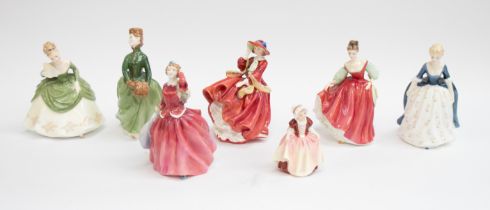 Seven Royal Doulton figures including: Fair Lady, Soiree, Grace, Top o' the Hill, Blithe Morning,
