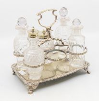 An early to mid 20th century silver plate and glass condiment set