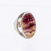 A Blue John and silver ring, set with an oval stone, width approx 24mm, split shoulders, size R1/