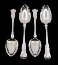 A set of four George III Scottish silver Queen's pattern table spoons, three engraved with a shield,