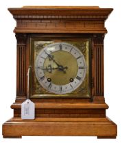 A 20th century cased bracket/mantel clock with brass detail.