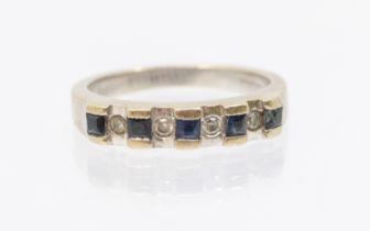 A sapphire and diamond 9ct white gold half eternity ring, comprising a row of alternate calibre