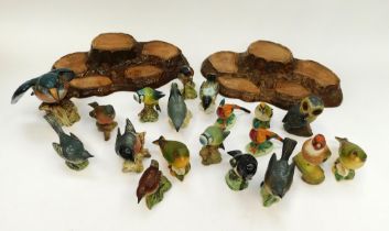 Beswick - A collection of birds together with 2 tree stump display stands.