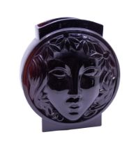 A decorative French amethyst glass Art Deco period vase, with moulded Face design to sides, marked