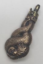 A rare 19th century entwined dolphins powder flask. Copper body depicting stylised dolphins,