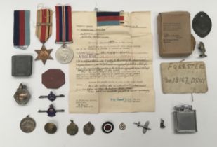 A selection of WWII medals, sweetheart brooches and other items. To include: a WW2 Africa Star