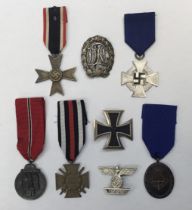 A selection of WW2 German awards and decorations. To include: an Iron Cross 1st class, with iron