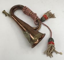 A vintage military style brass and copper bugle. Fitted with a brass Argyll & Sutherland Highlanders