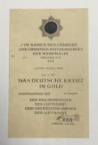 A scarce original WW2 era award certificate for the German Cross in gold. Printed document with