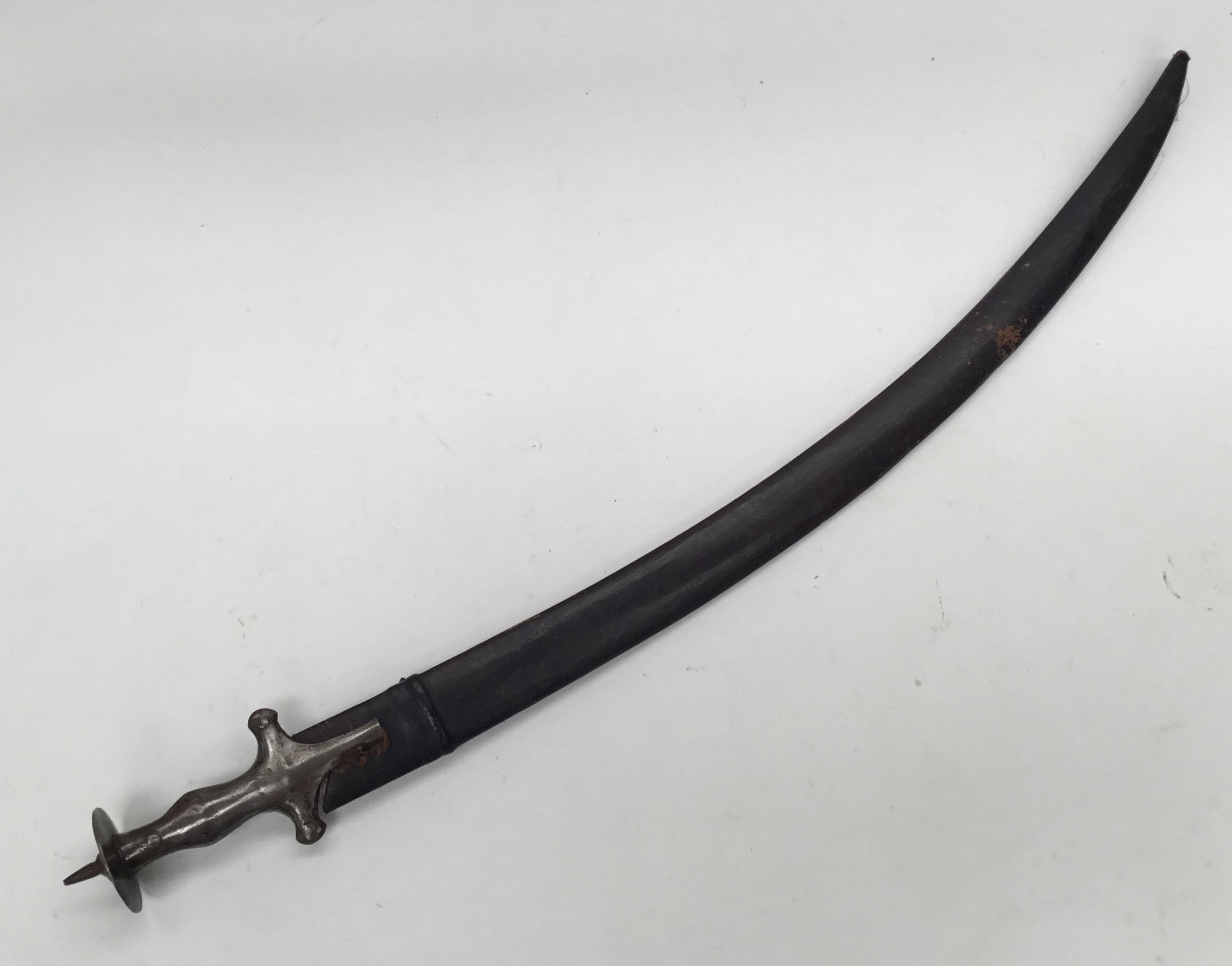 A late 19th / early 20th Indian talwar sword and scabbard. Of traditional form, all steel