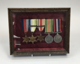 A WW2 Royal Navy medal group, framed and glazed, attributed to G.C.Christopher C/KX 128210.