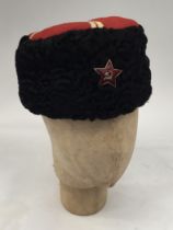 A Soviet Russian WW2 / 50’s Cossack hat. Black Astrakhan sides, and a red wool crown with yellow