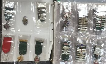 Album of National Safe Driving Medals and Clasps, including two medals that are hallmarked Silver