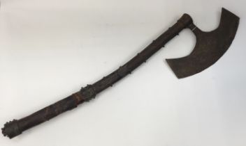 An unusual European 18th / 19th century bearded axe. Curved wooden haft with handmade iron studs