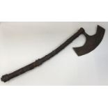 An unusual European 18th / 19th century bearded axe. Curved wooden haft with handmade iron studs