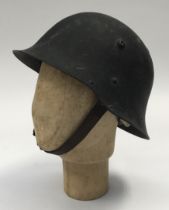 An unusual WW2 era Bulgarian M36 c type combat helmet, which appears to have been re-painted and