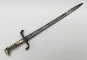 An 1871 pattern Imperial Prussian bayonet, dated 1873. Brass handle with diagonally grooved grip and