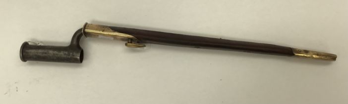 British ‘Brown Bess’ Socket Bayonet with scabbard, not marked, blade length 38cm. Some pitting to