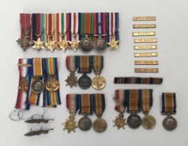 A selection of British miniature medals, and other medal accessories. To include: 2 WW1 1914 star