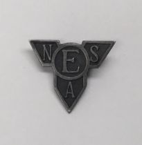 A scarce WW2 era Entertainments National Service Association ‘ENSA’ cap or lapel badge. White