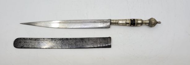 A Brazilian Faca Filingo gaucho dagger, in locking steel sheath, having 19.9cm single edged blade,