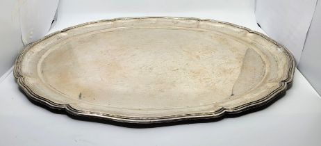 A large continental .800 silver oval salver, having scalloped stepped rim, impressed marks including