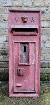 An original Victorian cast iron Royal Mail wall mounted post box, cast in relief "V" and "R"