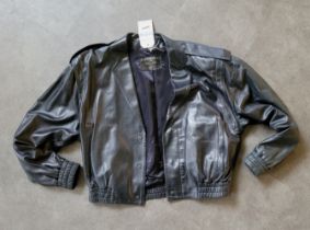Elton John's black leather jacket, with press stud fastenings and elasticated waist and cuffs,