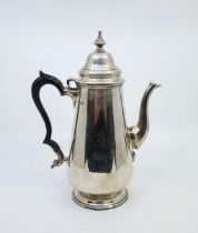 A large silver coffee pot, by Goldsmiths & Silversmiths Co Ltd, London 1904, height 27cm. (gross