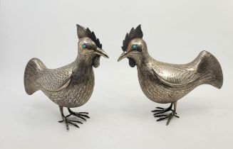 A pair of 20th century silver plated cockerels, with engraved feather detail and set round