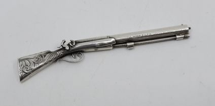 A scarce early Victorian silver novelty pencil in the form of a percussion muzzle-loading rifle,