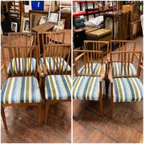 Two sets of four chairs (8) all upholstered in matching striped fabric  with teak frames.