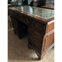 A 20th century mahogany pedestal desk, leather inlay writing surface with a moulded edge top,