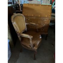 A 20th Century mahogany bureau, fall front enclosing pigeon holes and leather writing surface, above