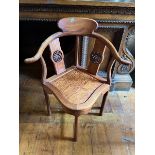 Orientally inspired corner chair.