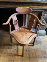 Orientally inspired corner chair.