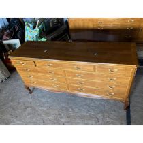 A recent mahogany sideboard, rectangular shape with canted corners, an arrangement of nine