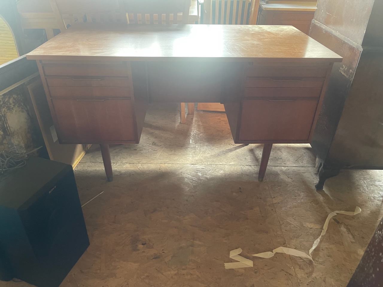 A mid 20th century teak kneehole desk.