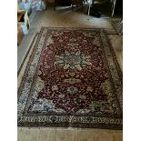 Persian style rug in creams and reds with blue accents 7'3" x 6'1"  aprox
