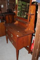 An Arts and Crafts oak dressing table. 140cm H x 107cm W x 49cm D