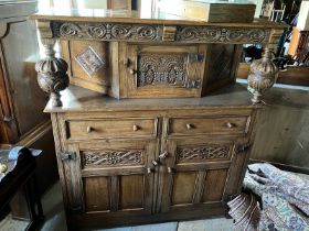 20th c Oak buffet, centre cupboard with twin baluster supports over a two drawer, two cupboard