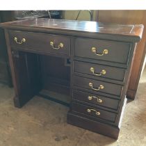 A 20th Century mahogany kneehole computer desk. faux drawer fronted cupboard and pull out work