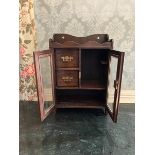 Edwardian, possibly later oak Smoking cabinet. bevelled glass to lockable doors with Key. two