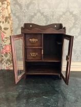 Edwardian, possibly later oak Smoking cabinet. bevelled glass to lockable doors with Key. two