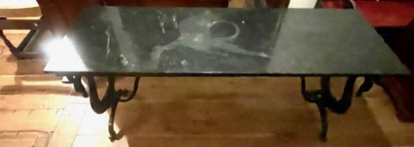 A marble top and painted cast iron table. 20th century.  Staining/ loss of  finish of marble top