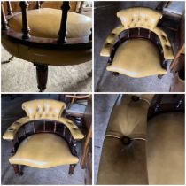 Mustard leather Captains style chair on four turned mahogany legs over brass castors  38cms approx