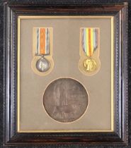 A framed WW1 casualty pair and plaque, awarded to 5190 / 322392 Rifleman Frank Thomas Pead of the