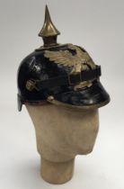 A WW1 era 1895 pattern Baden Pickelhaube helmet. Of traditional form, with a leather skull, peak and