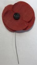 A Rear early ‘Haig Fund’ Poppy in good condition with original button Centre and wire suspension.
