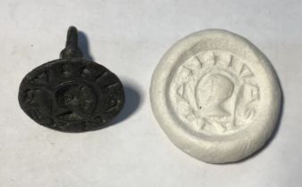 Medieval “chess piece” circular style bronze seal matrix, hexagonally facetted handle with pointed
